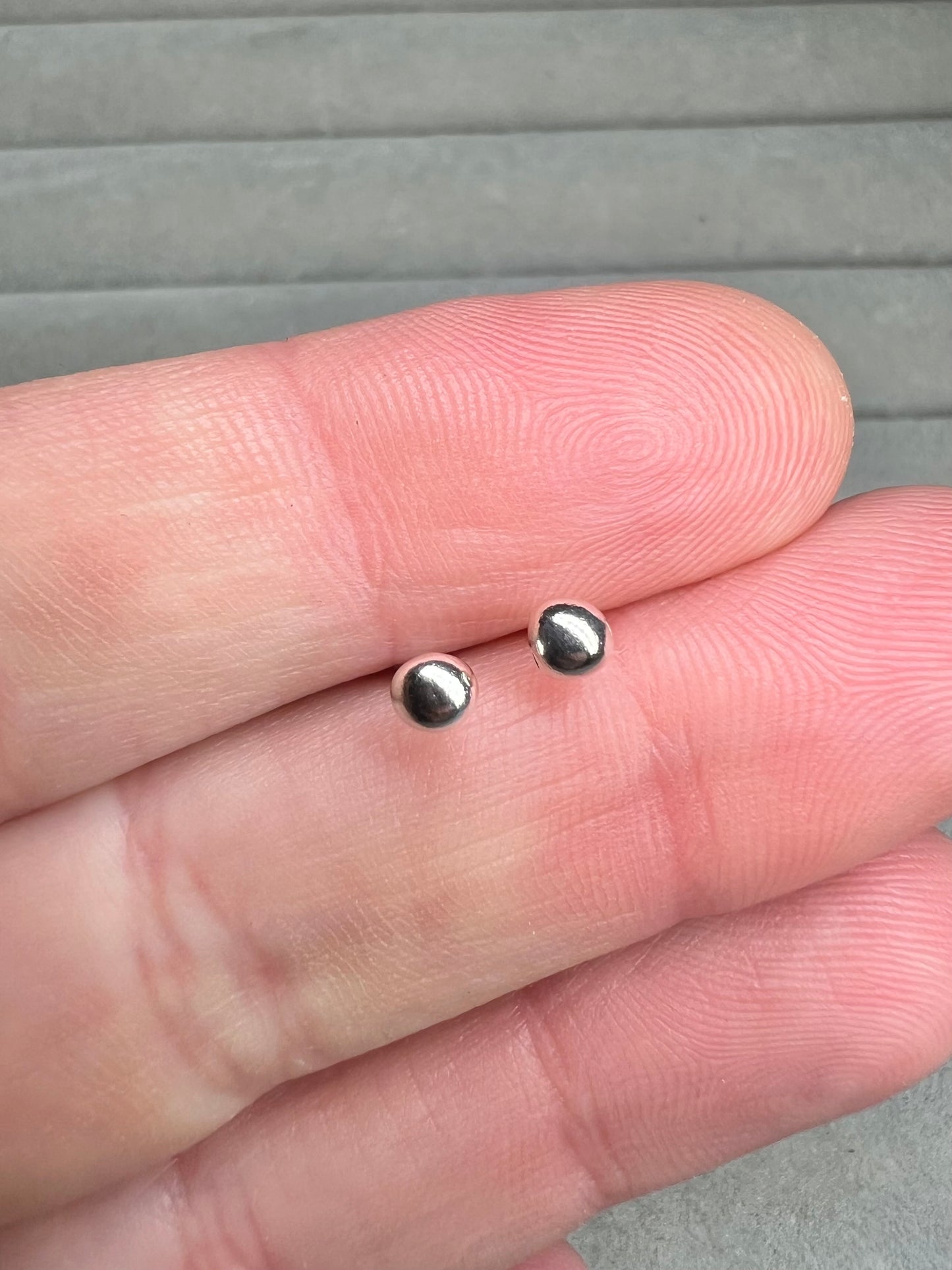 Tiny molten silver ball studs