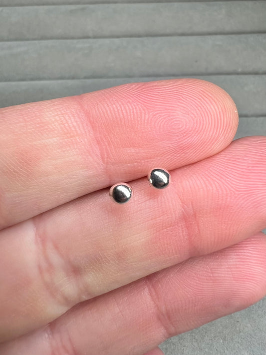 Tiny molten silver ball studs