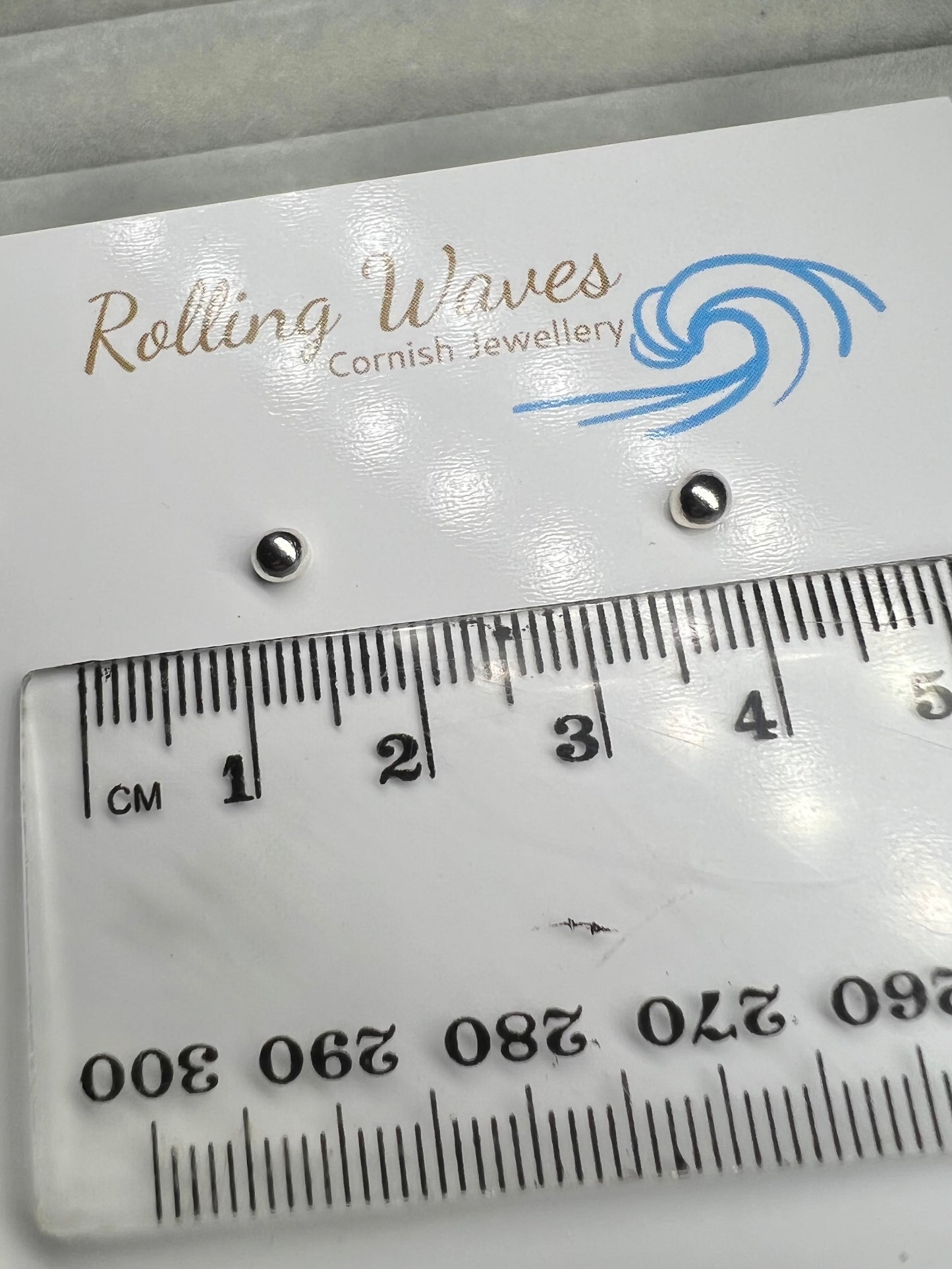 Tiny molten silver ball studs