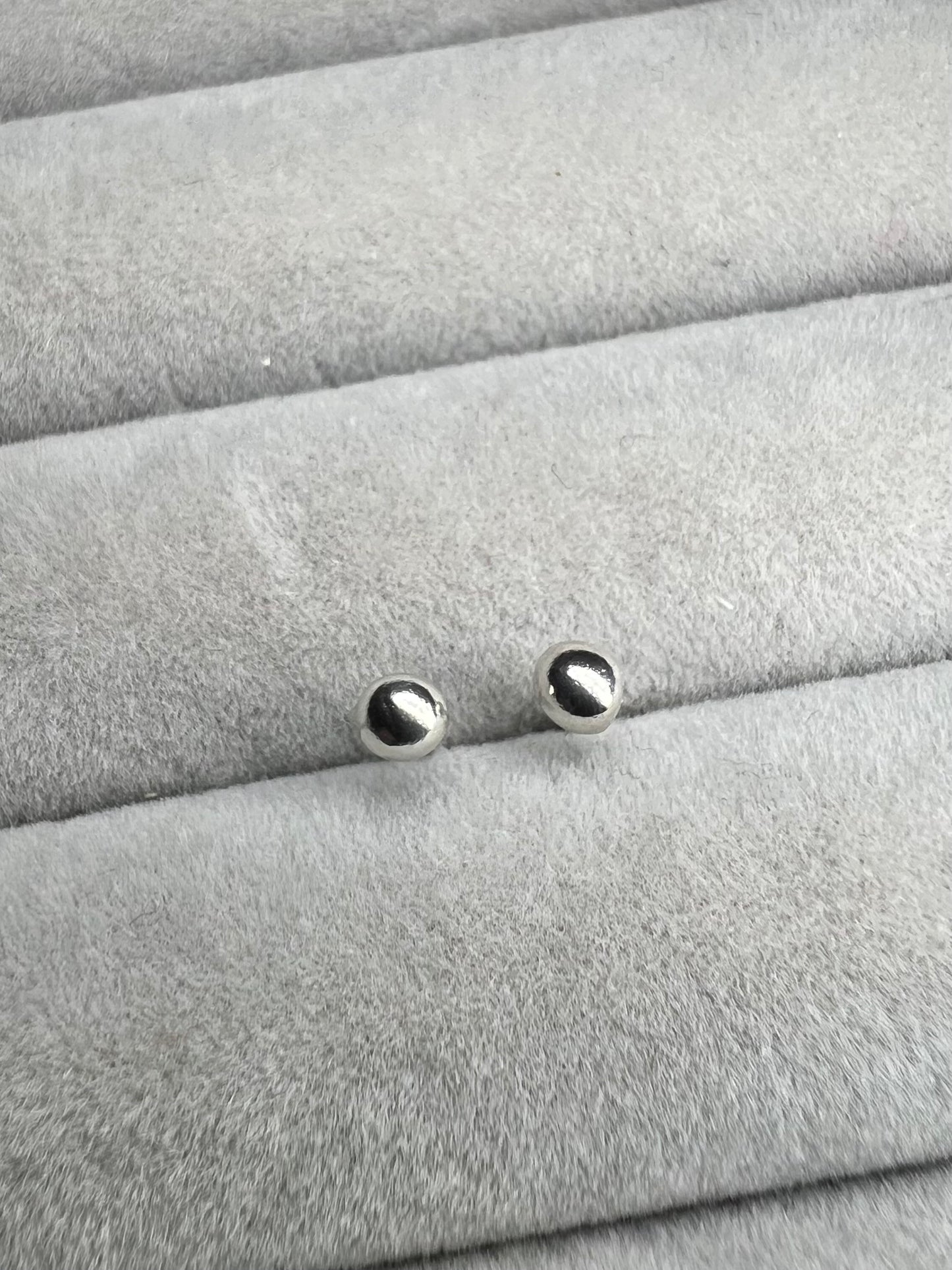 Tiny molten silver ball studs